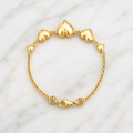 Pulsera de oro de 10k amarillo con diseño de corazones