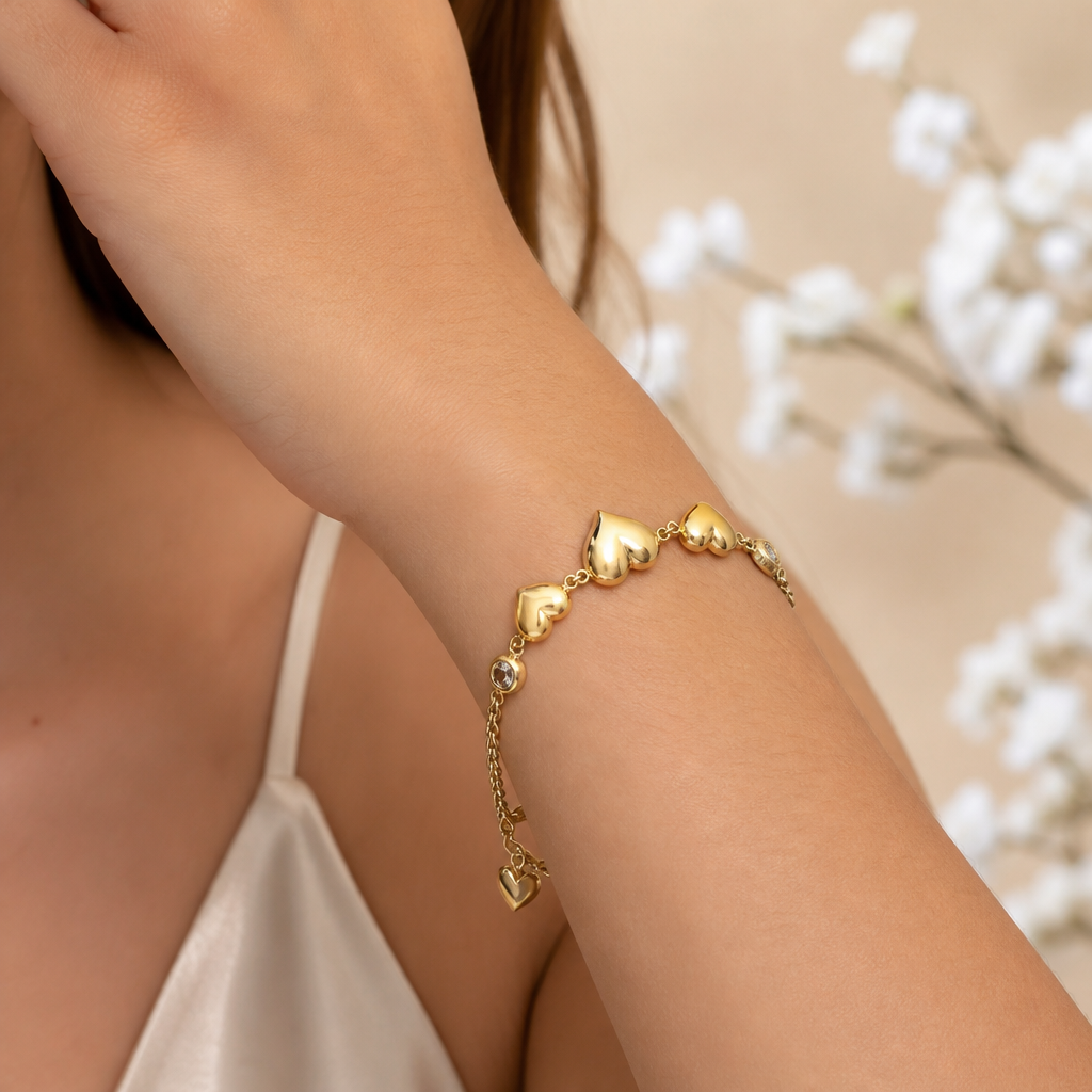 Pulsera de oro de 10k amarillo con diseño de corazones