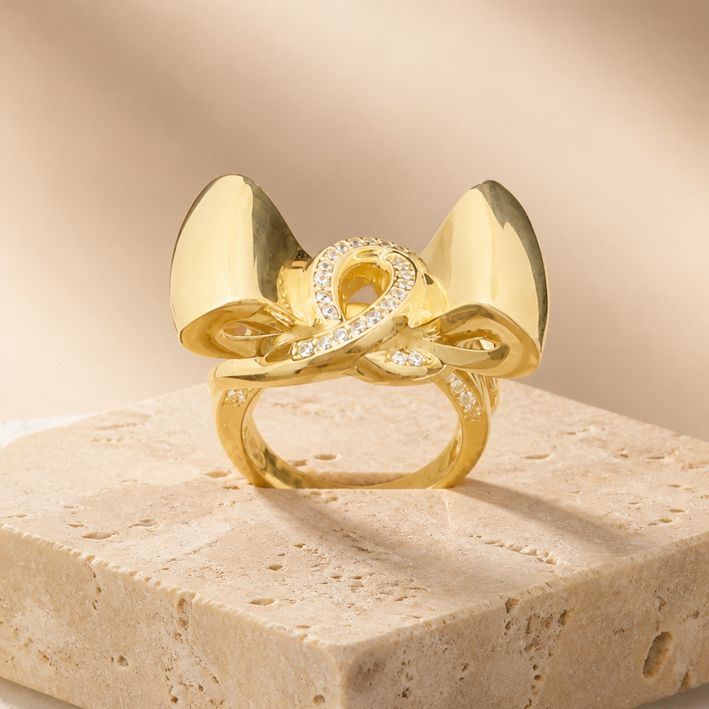 Elegante anillo de oro 10k dorado con diseño de moño